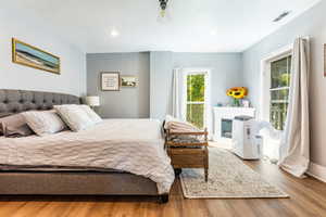 Bedroom with wood-type flooring