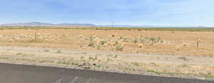 Property view of mountains with a rural view