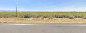 Property view of mountains with a rural view