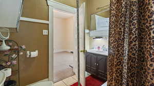 Bathroom with vanity and tile patterned flooring