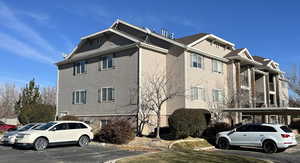 View of side of property featuring a carport