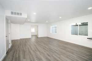 Spare room featuring hardwood / wood-style flooring