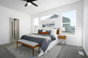 Bedroom featuring ceiling fan and carpet