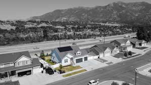 Birds eye view of property with a mountain view