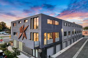 Outdoor building at dusk with a garage