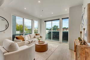 Living room with light hardwood / wood-style floors