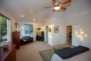 Master bedroom with vaulted ceiling, a closet, and ceiling fan