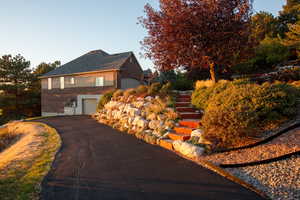 View of side of home with a garage