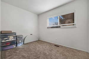 Empty room featuring carpet