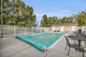 View of swimming pool with a patio area