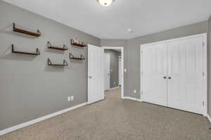 Unfurnished bedroom with a closet and a textured ceiling