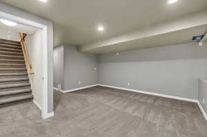 Basement family room featuring carpet