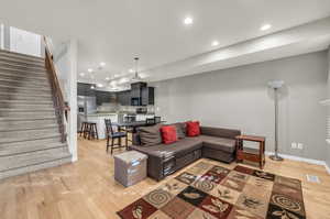 Living room with light wood-type flooring