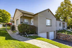 View of property exterior with a garage