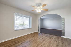 Empty room featuring light hardwood / wood-style floors and ceiling fan