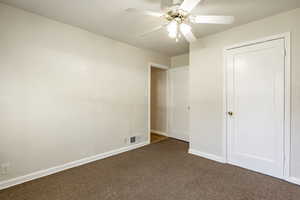 Unfurnished bedroom featuring carpet and ceiling fan