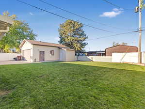 View of yard featuring a garage