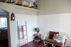 Sitting room with dark hardwood / wood-style floors