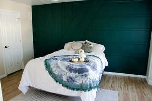 Primary Bedroom with light wood-type flooring