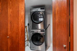 Laundry room featuring stacked washer / dryer