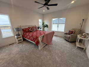 Carpeted bedroom with ceiling fan