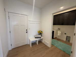 Mudroom featuring light wood-type flooring