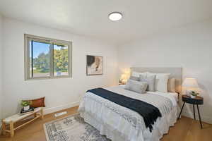 Bedroom featuring wood-type flooring