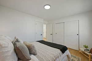 Bedroom featuring a closet and light hardwood / wood-style flooring