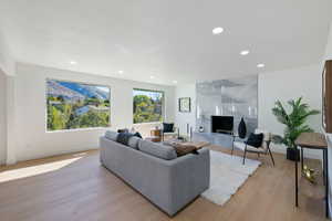 Living room with light hardwood / wood-style floors