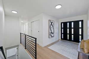 Entryway with light hardwood / wood-style floors