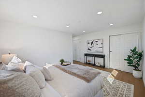 Bedroom featuring dark wood-type flooring