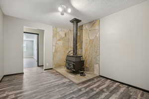 Den/living room featuring a wood stove