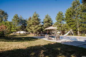 View of yard with a patio area