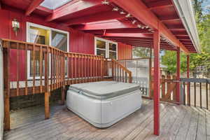 Wooden deck with a hot tub