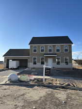 View of front facade with a garage