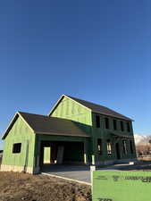 Property in mid-construction with a mountain view and a garage