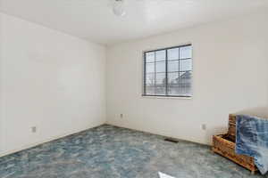 Spare room featuring light colored carpet