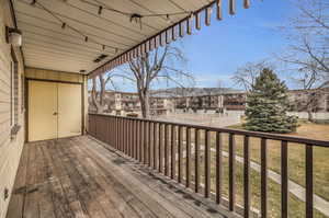 Balcony with pool view and small storage shed.