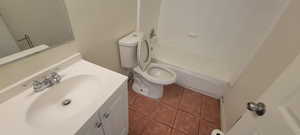 Full bathroom with vanity, toilet, tile patterned flooring, and tub / shower combination