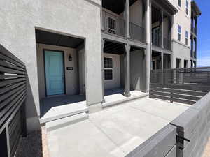 Fenced in front patio and covered front porch with mountain views