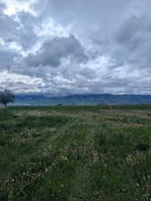 View of mountain background featuring rural landscape