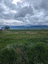 View of undeveloped land featuring rural landscape and a mountainous background