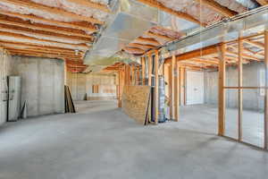 Basement featuring water heater