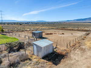 Birds eye view of property featuring a rural view and a mountain view