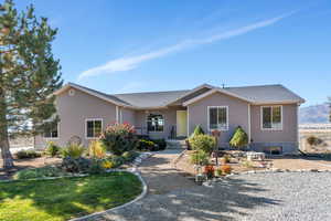 Ranch-style home with a mountain view and covered porch