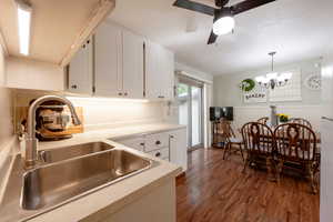 Kitchen featuring sink and cabinetry. View towards dining area.