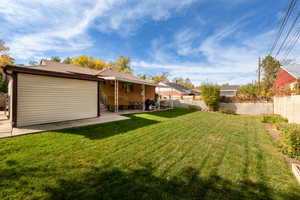 View of yard facing north. See attached shed, patio and fully fenced yard.