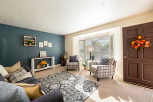 Living room with baybox window and natural light.