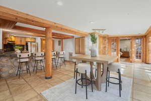 Kitchen with backsplash and stainless steel fridge