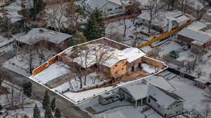 View of aerial landscape, showcasing two driveways, an attached two-car garage, RV parking, and additional storage space.